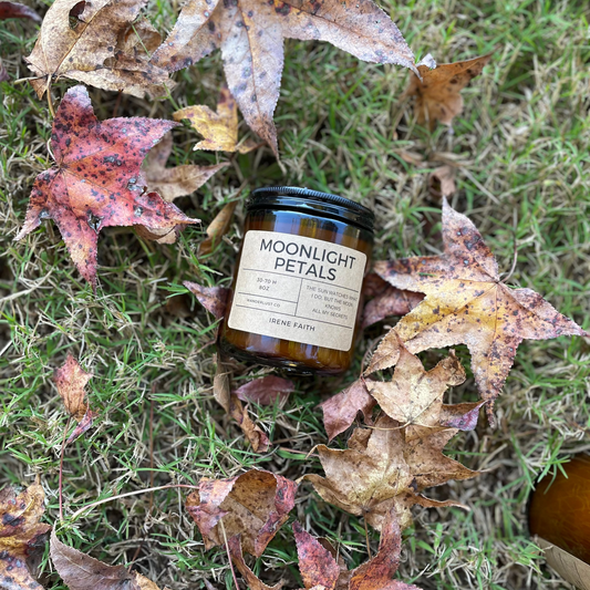 Jar of 'Moonlight Petals' on grass with autumn leaves